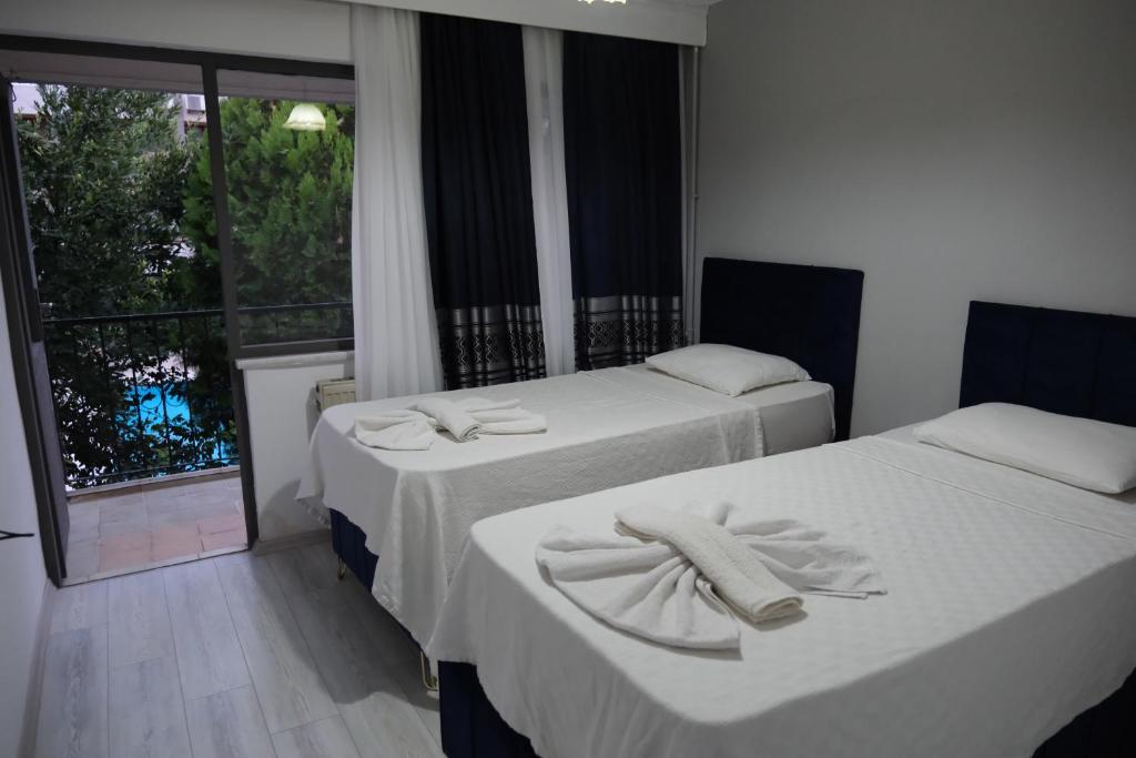 Postel nebo postele na pokoji v ubytování Artemis Yörük Hotel - Pamukkale Denizli