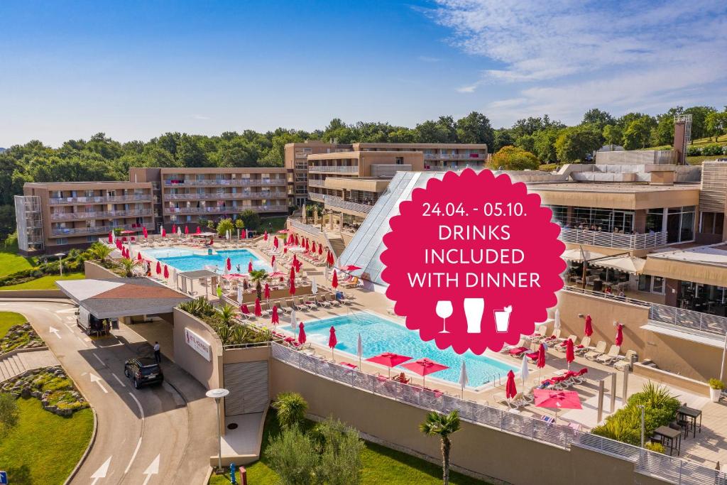 an aerial view of the pool at a resort at Hotel Molindrio Plava Laguna in Poreč