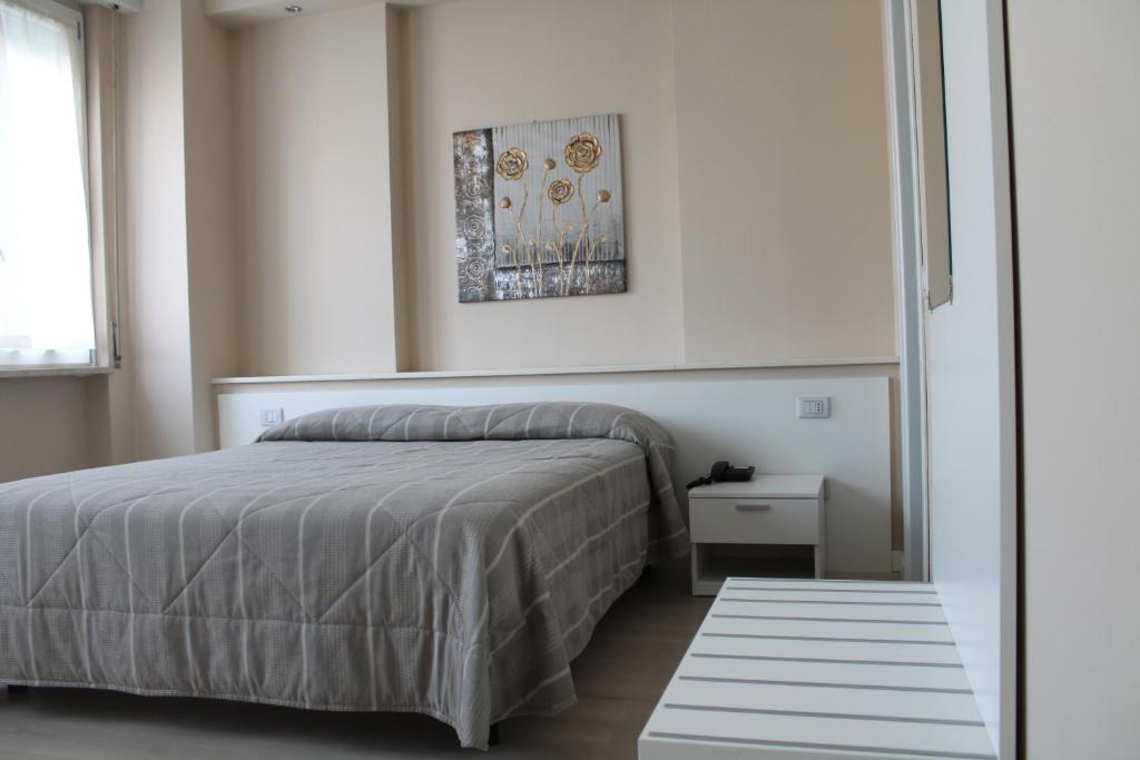 Postel nebo postele na pokoji v ubytování Hotel Cremona Viale