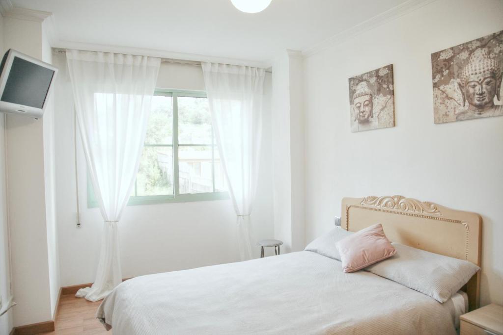 Posteľ alebo postele v izbe v ubytovaní Apartamento Grañamar Grove
