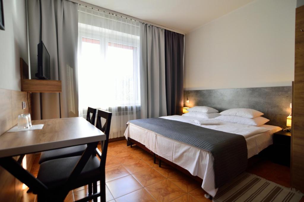 Posteľ alebo postele v izbe v ubytovaní Hotel Gracja