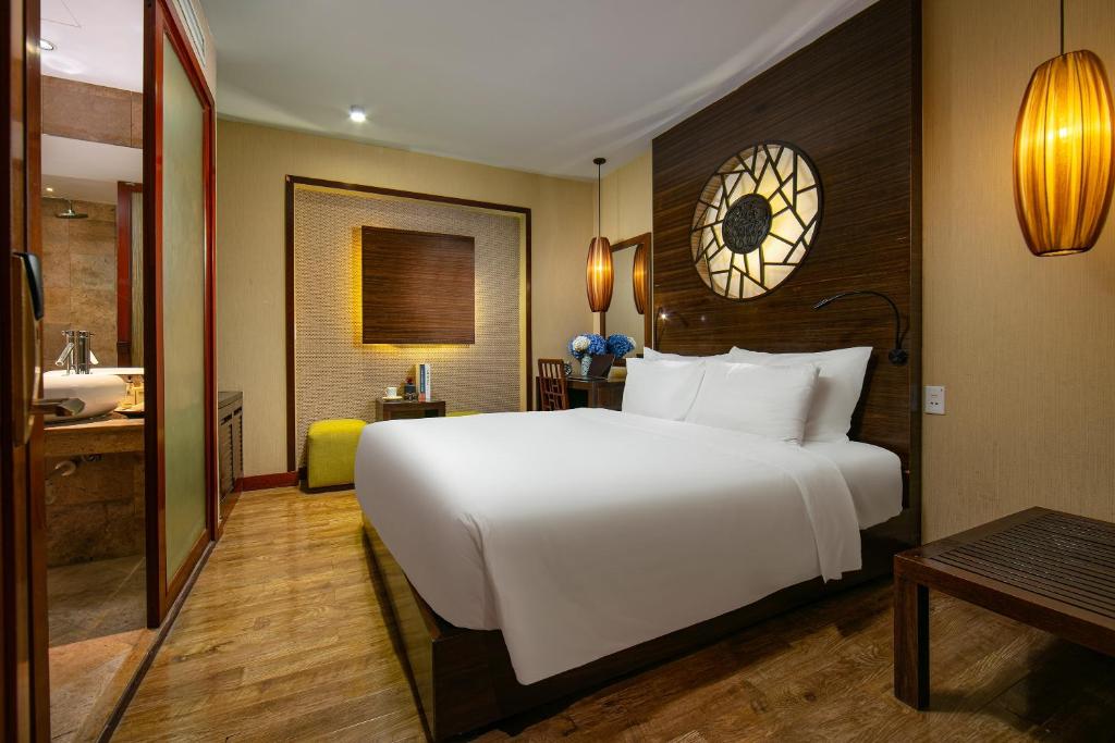 Postel nebo postele na pokoji v ubytování Oriental Suites Hotel & Spa