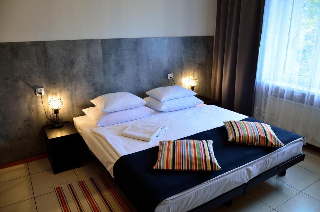 Posteľ alebo postele v izbe v ubytovaní Hotel Gracja