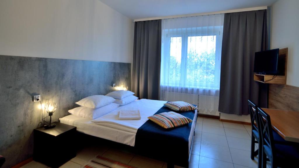 Posteľ alebo postele v izbe v ubytovaní Hotel Gracja
