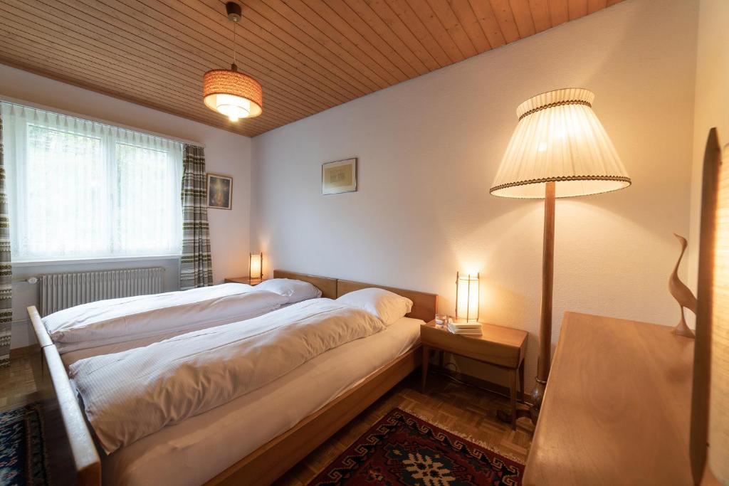 Postel nebo postele na pokoji v ubytování Jambo Pua