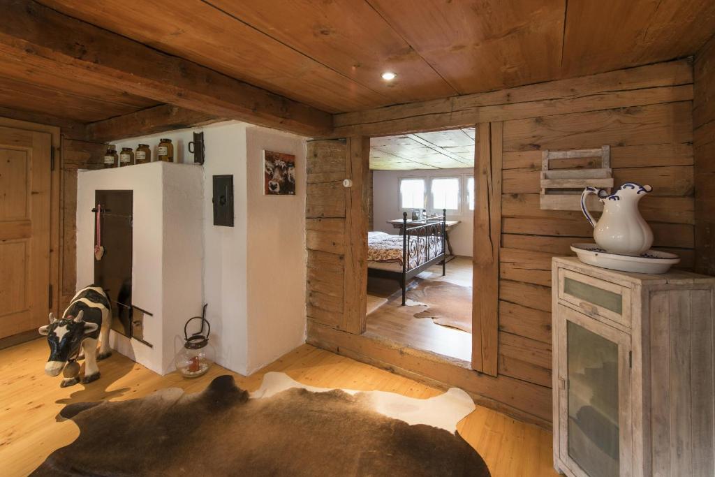 a room with a cow laying on the floor at Landhuus Toggi in Alt Sankt Johann