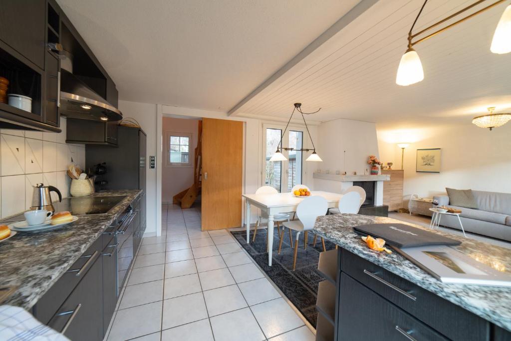 a kitchen and living room with a counter top at Lisa in Wildhaus