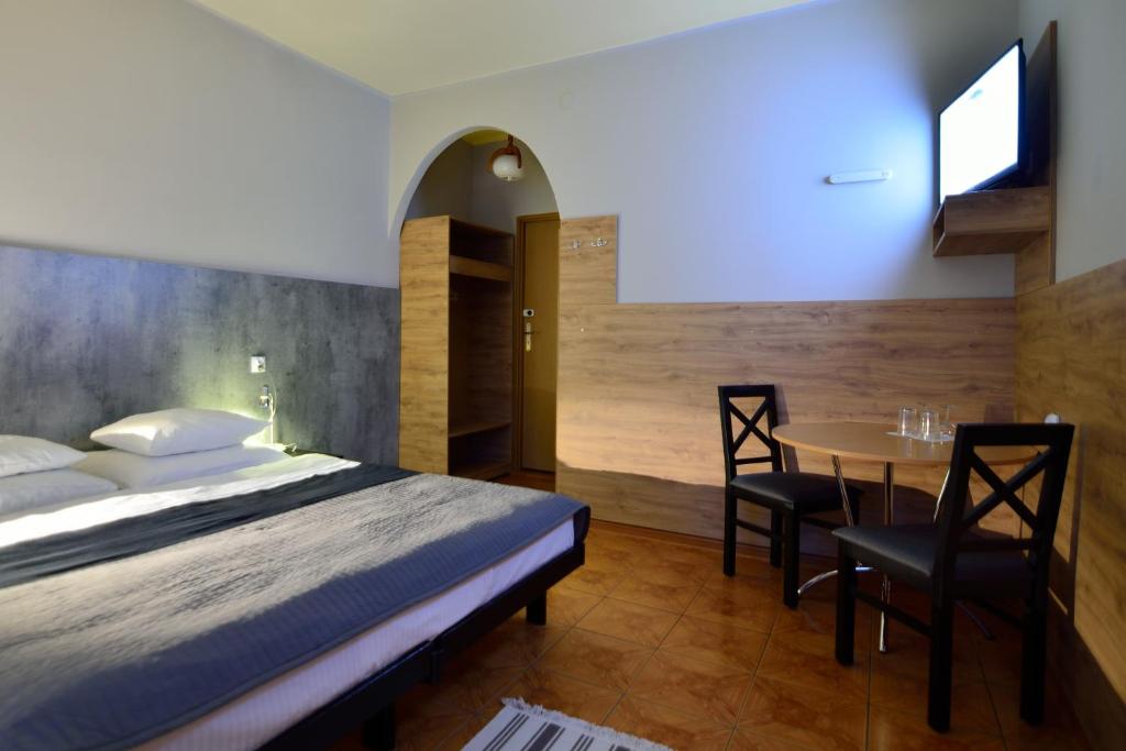 Posteľ alebo postele v izbe v ubytovaní Hotel Gracja