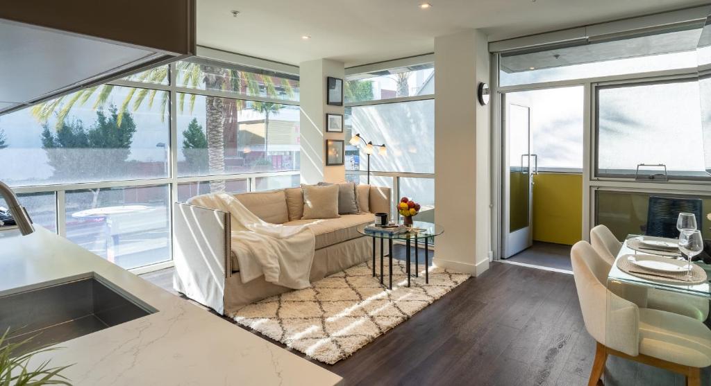 a living room with a couch and a table at Stylish Condo By The Beach in Los Angeles