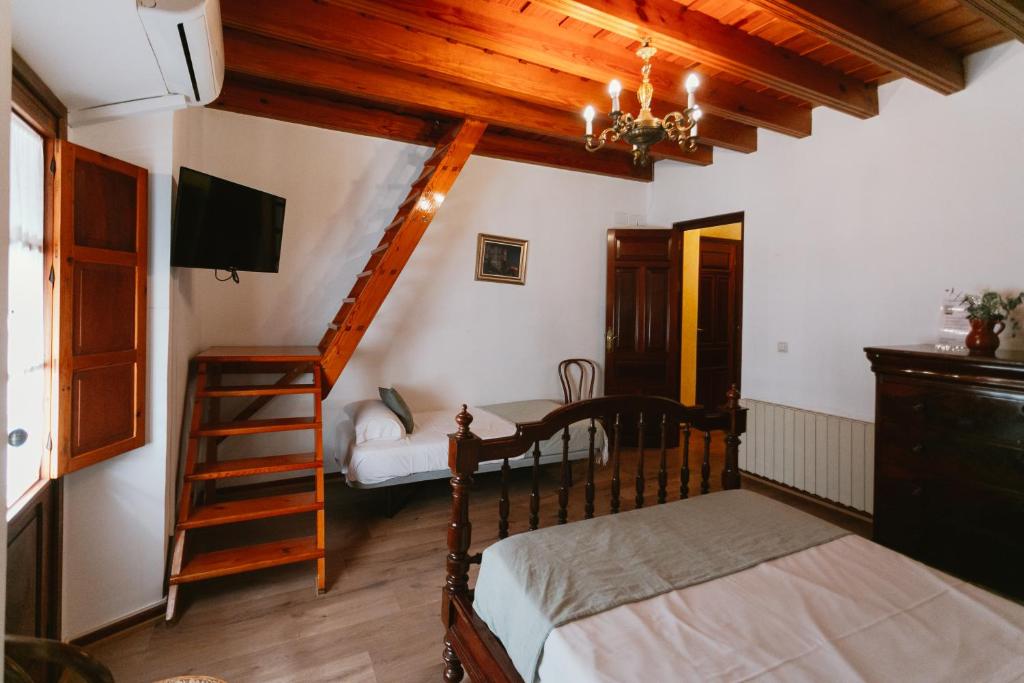 Postel nebo postele na pokoji v ubytování Komodo Casa Maravillas Rooms