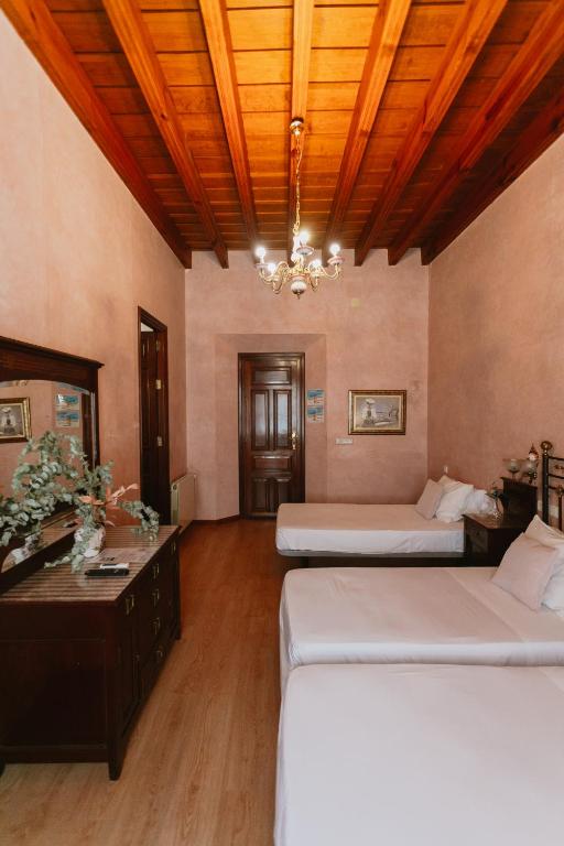 Postel nebo postele na pokoji v ubytování Komodo Casa Maravillas Rooms