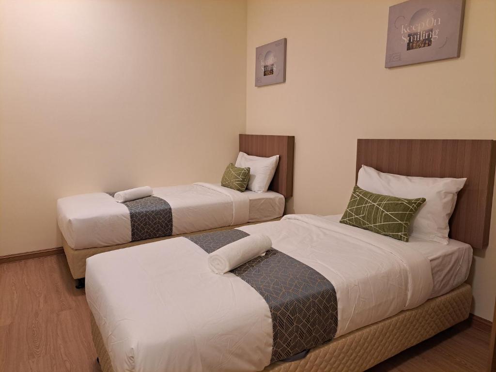 Postel nebo postele na pokoji v ubytování SCC HOTEL PJ