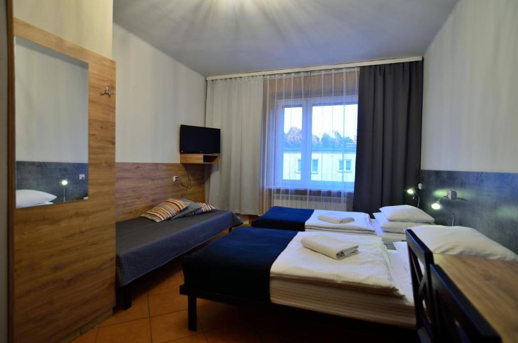 Posteľ alebo postele v izbe v ubytovaní Hotel Gracja