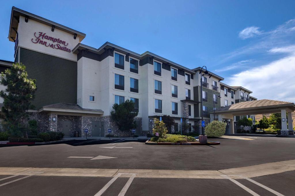 a hotel parking lot in front of a building at Hampton Inn & Suites San Luis Obispo in San Luis Obispo