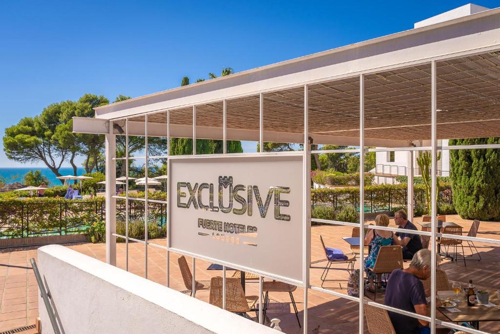 a sign for an inclusive event in a building at Hotel Fuerte Conil-Resort in Conil de la Frontera