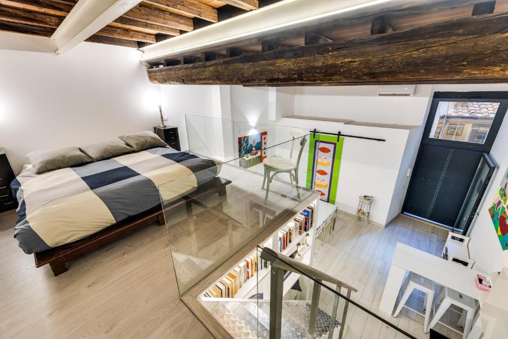 A bed or beds in a room at Rome Historic Center Cozy LOFT