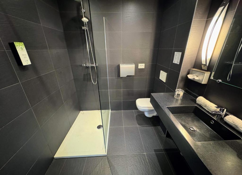 Koupelna v ubytování Hôtel L'Amandier