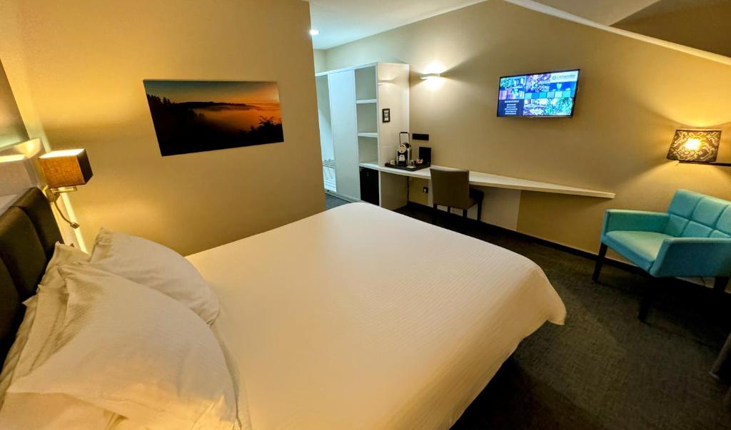 Postel nebo postele na pokoji v ubytování Hôtel L'Amandier