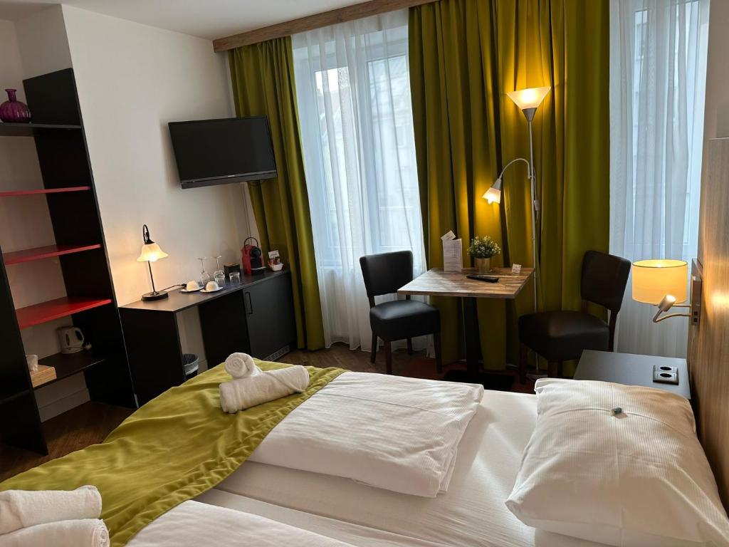 Postel nebo postele na pokoji v ubytování Versava Apartments