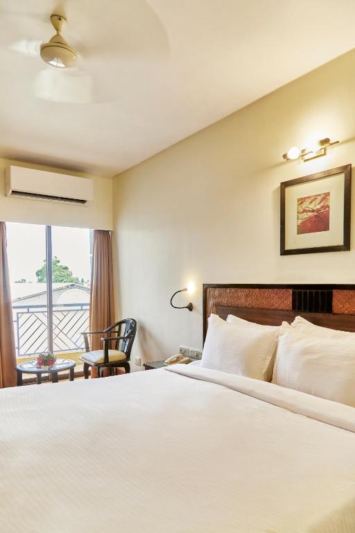Postel nebo postele na pokoji v ubytování Hotel Orion Centrally near North Goa & Panjim