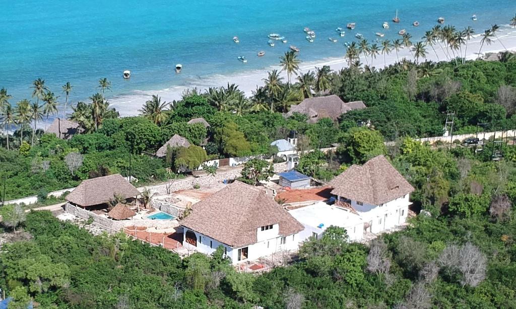 an aerial view of a resort on the beach at Holiday Time Bungalows Sansibar in Gazija
