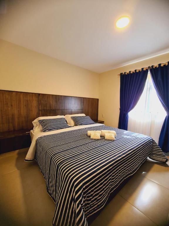 Postel nebo postele na pokoji v ubytování Hotel Villa