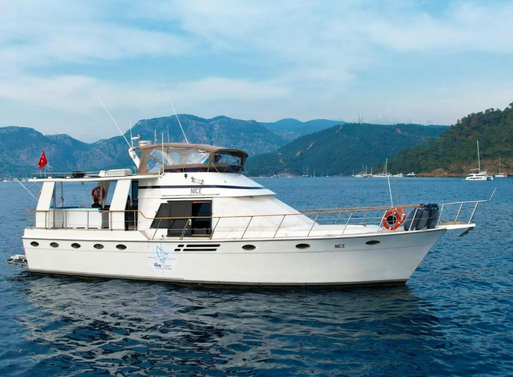 a white boat in the water on a lake at Vira Yacht in Göcek