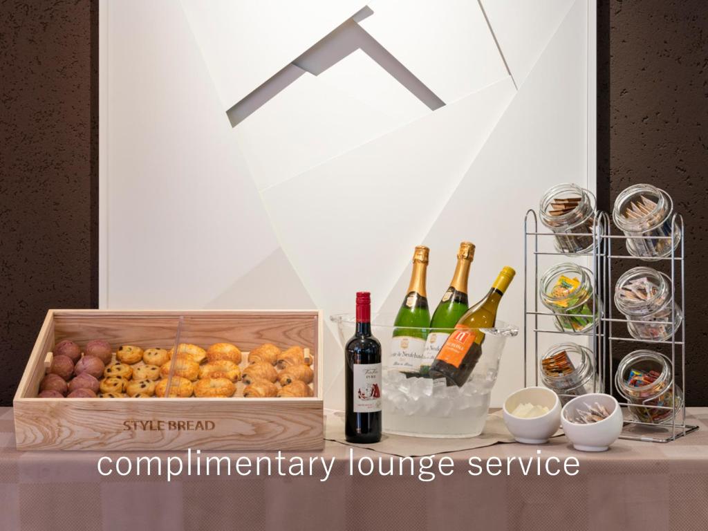 a box of wine and wine glasses and wine bottles at Hotel The Celestine Tokyo Shiba in Tokyo