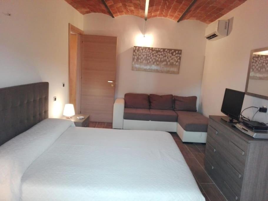 En eller flere senger på et rom på Casa Vacanza Le Casette di Monteverde