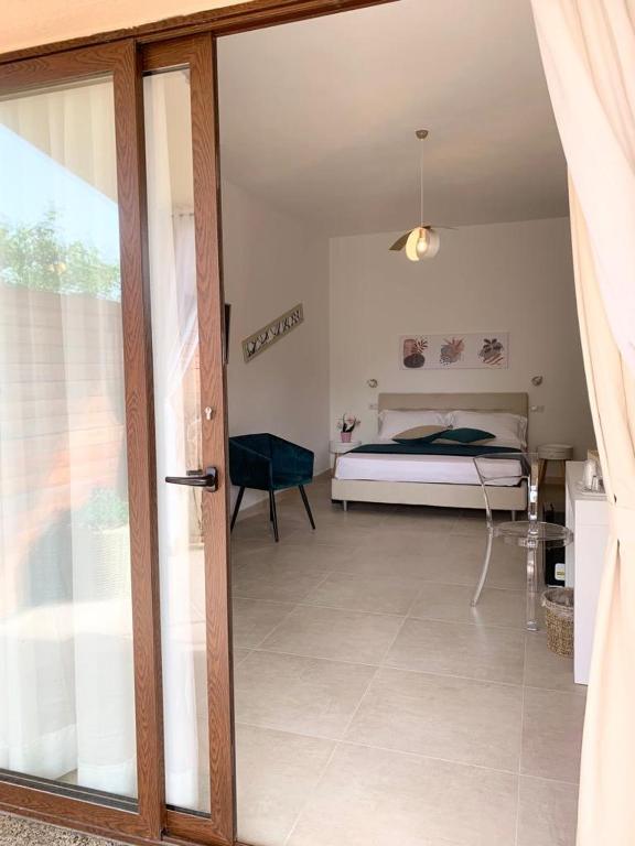 Postel nebo postele na pokoji v ubytování B&B Jolie Suite