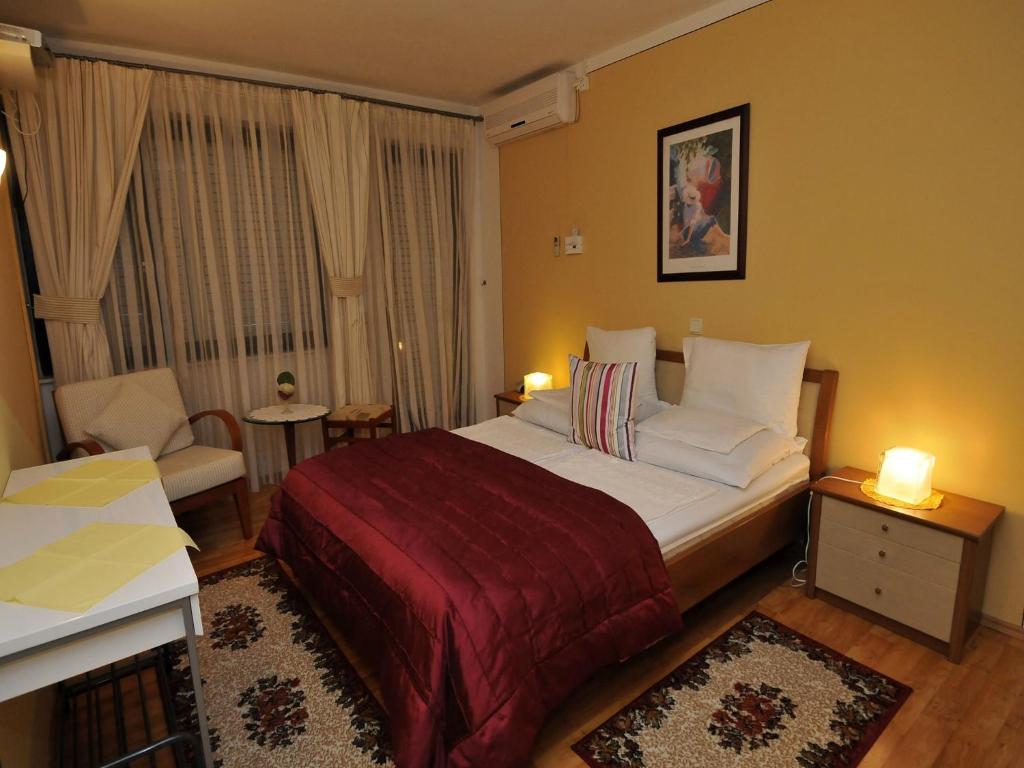 Postel nebo postele na pokoji v ubytování Hotel Haus Am Meer Cavtat