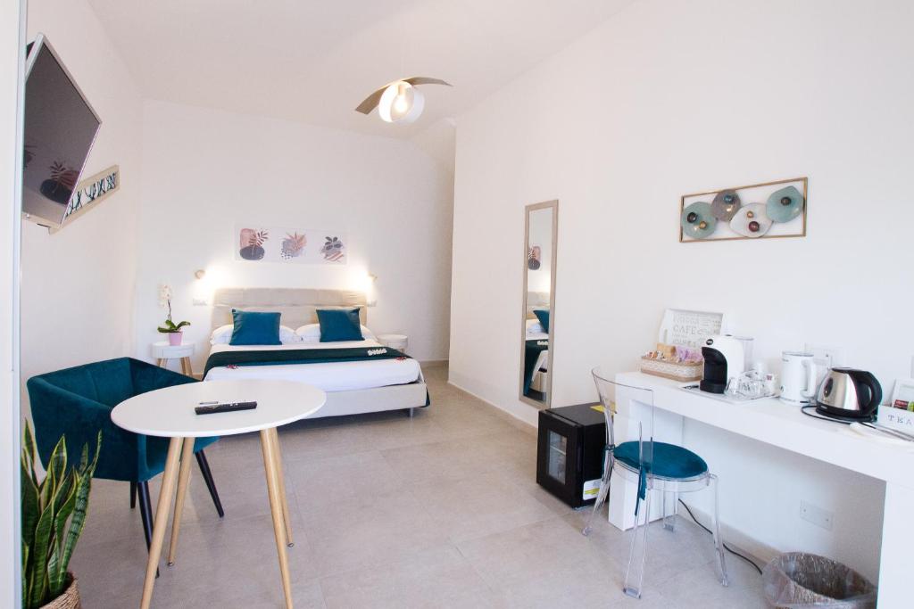 Postel nebo postele na pokoji v ubytování B&B Jolie Suite