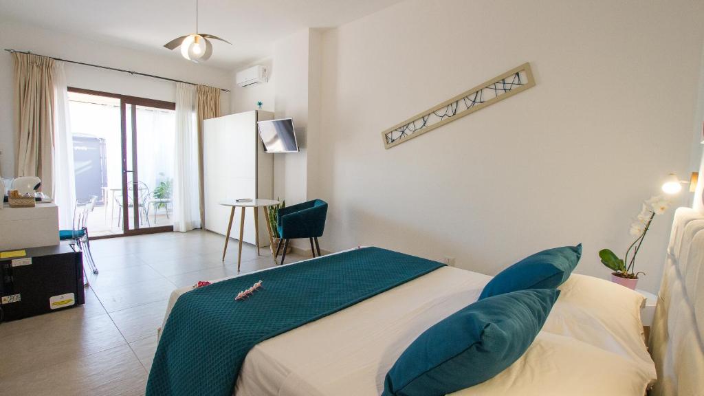 Postel nebo postele na pokoji v ubytování B&B Jolie Suite
