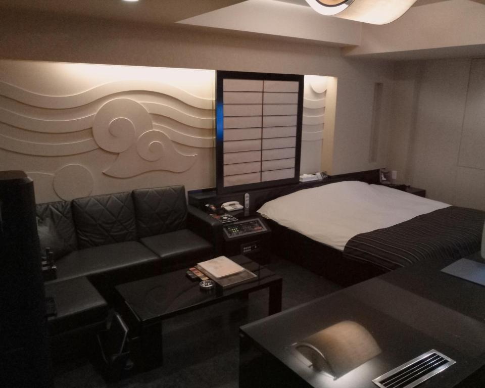 Postel nebo postele na pokoji v ubytování ＳＴＡＲＲＥＳＯＲＴ　Ｉ