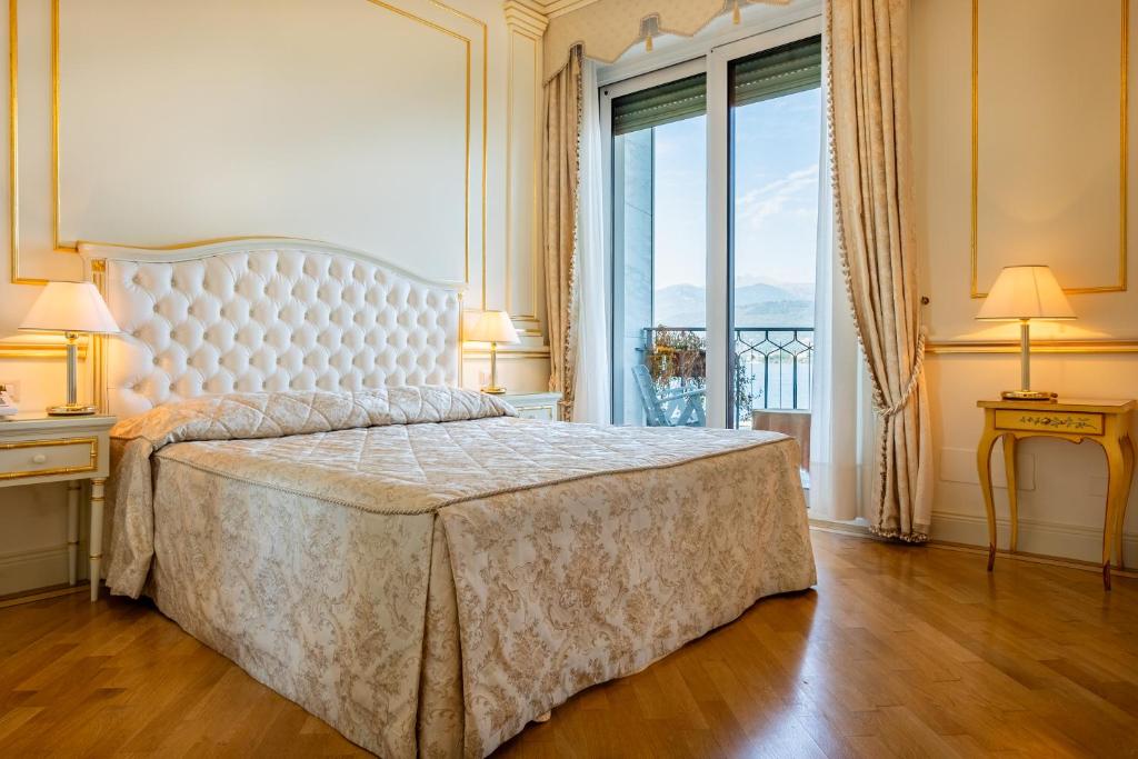 Postel nebo postele na pokoji v ubytování Hotel Astoria