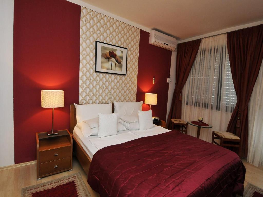 Postel nebo postele na pokoji v ubytování Hotel Haus Am Meer Cavtat