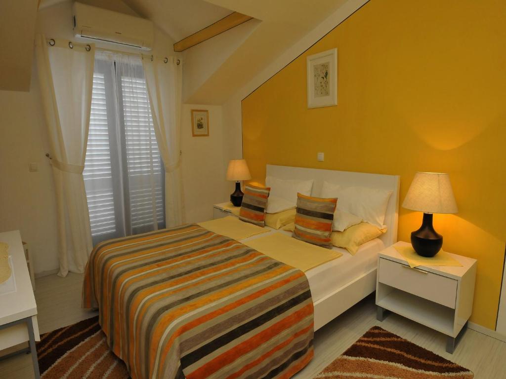 Postel nebo postele na pokoji v ubytování Hotel Haus Am Meer Cavtat