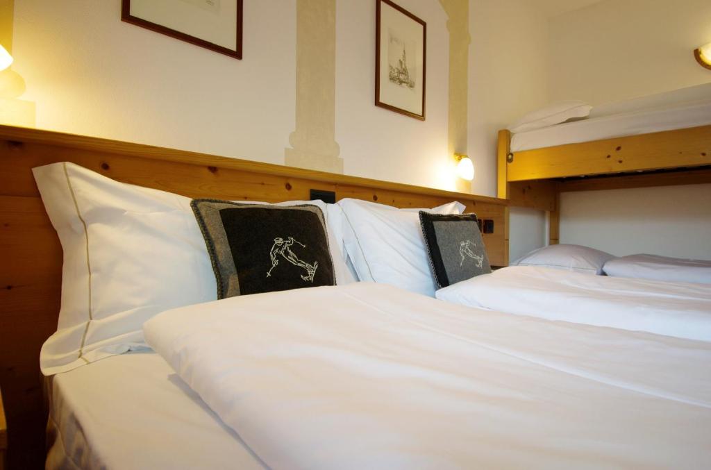 Postel nebo postele na pokoji v ubytování Hotel Belfiore