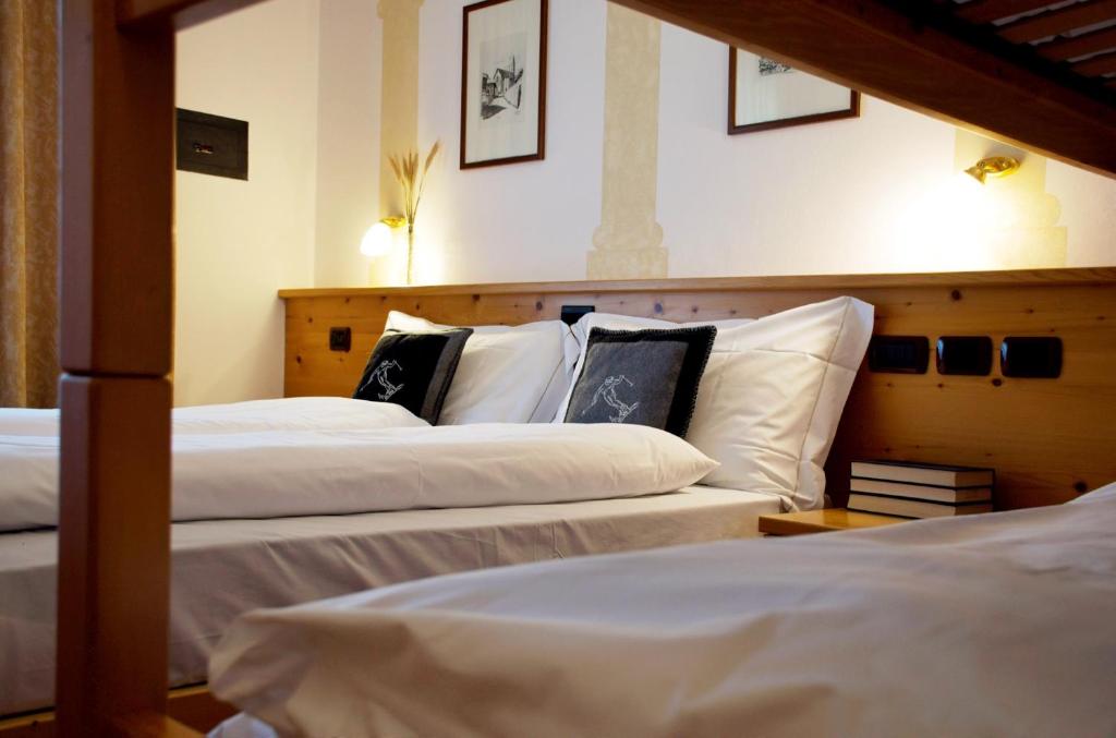 Postel nebo postele na pokoji v ubytování Hotel Belfiore