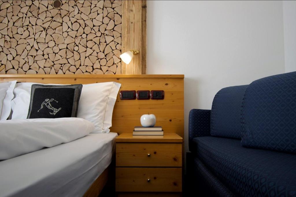 Postel nebo postele na pokoji v ubytování Hotel Belfiore
