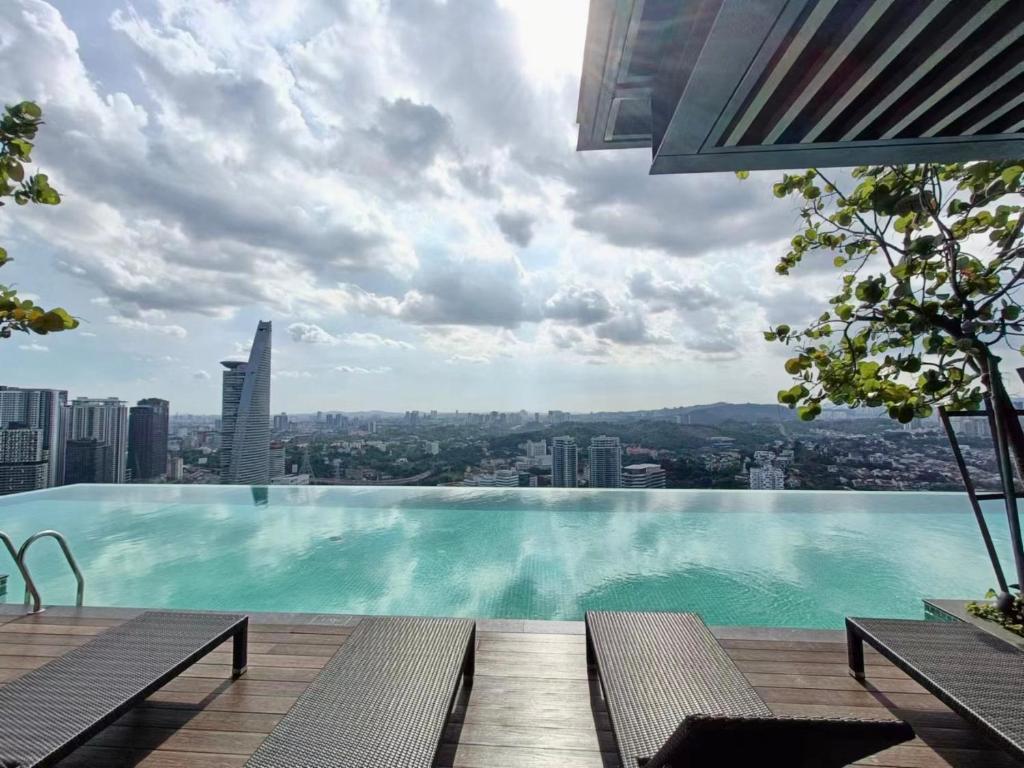 a swimming pool on the roof of a building at Viia@Eco kl city#Mid Velly in Kuala Lumpur