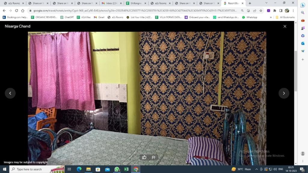 een pagina van een kamer met gordijnen en een bed bij Resort Abode Blue in Mandarmoni
