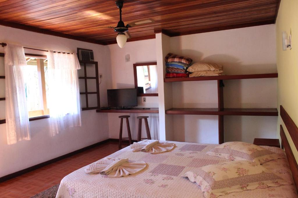 Postel nebo postele na pokoji v ubytování Pousada Flor de Paraty