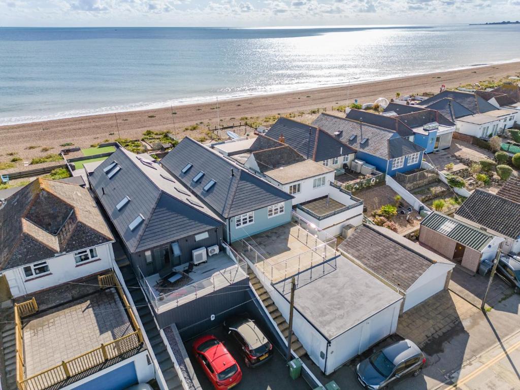 an aerial view of houses and the beach at Fisherman's Croft Your Dream Getaway Awaits in Pevensey