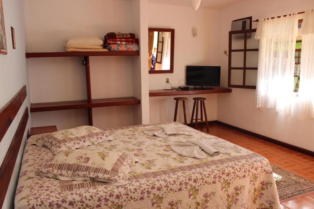 Postel nebo postele na pokoji v ubytování Pousada Flor de Paraty