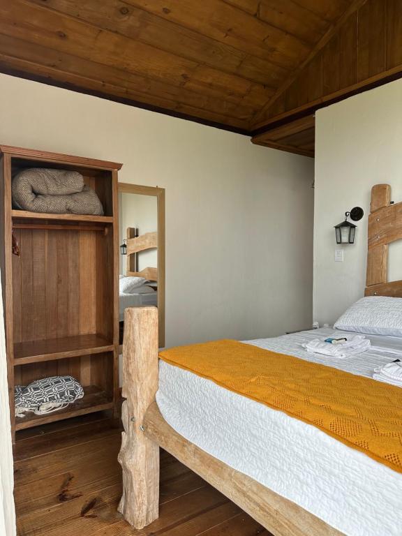 Postel nebo postele na pokoji v ubytování Nosso Chalet