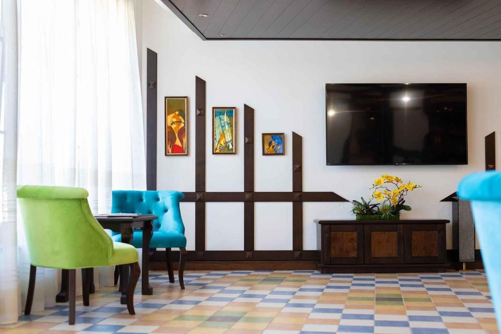 TV a/nebo společenská místnost v ubytování Armaco Residence