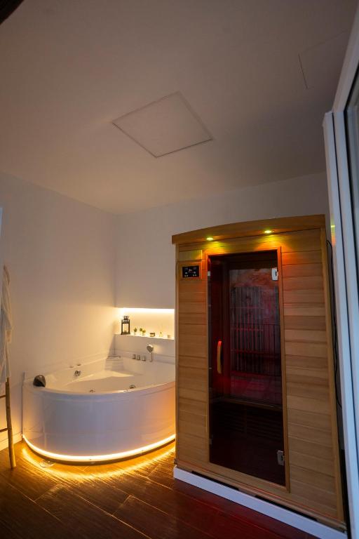 a bath room with a tub and a bath room at Luxury Moscatell 15 in Novelda