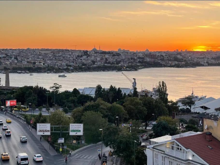 a view of a city with a river and a sunset at Beyoğlu/Taksim are also in a perfect location in Istanbul