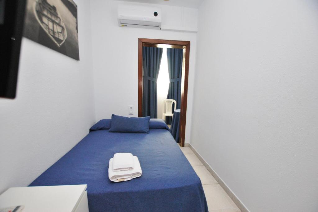 Posteľ alebo postele v izbe v ubytovaní Hotel Tres Leones
